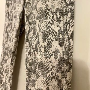 Snakeskin skinny jeans